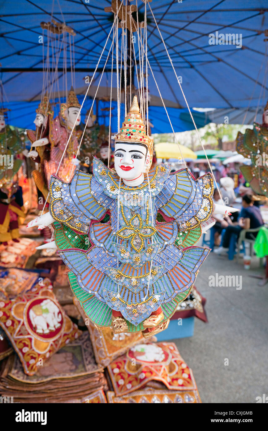 Street market stall with traditional puppet gift, near Tha Phae Gate, Chiang Mai, Thailand Stock Photo