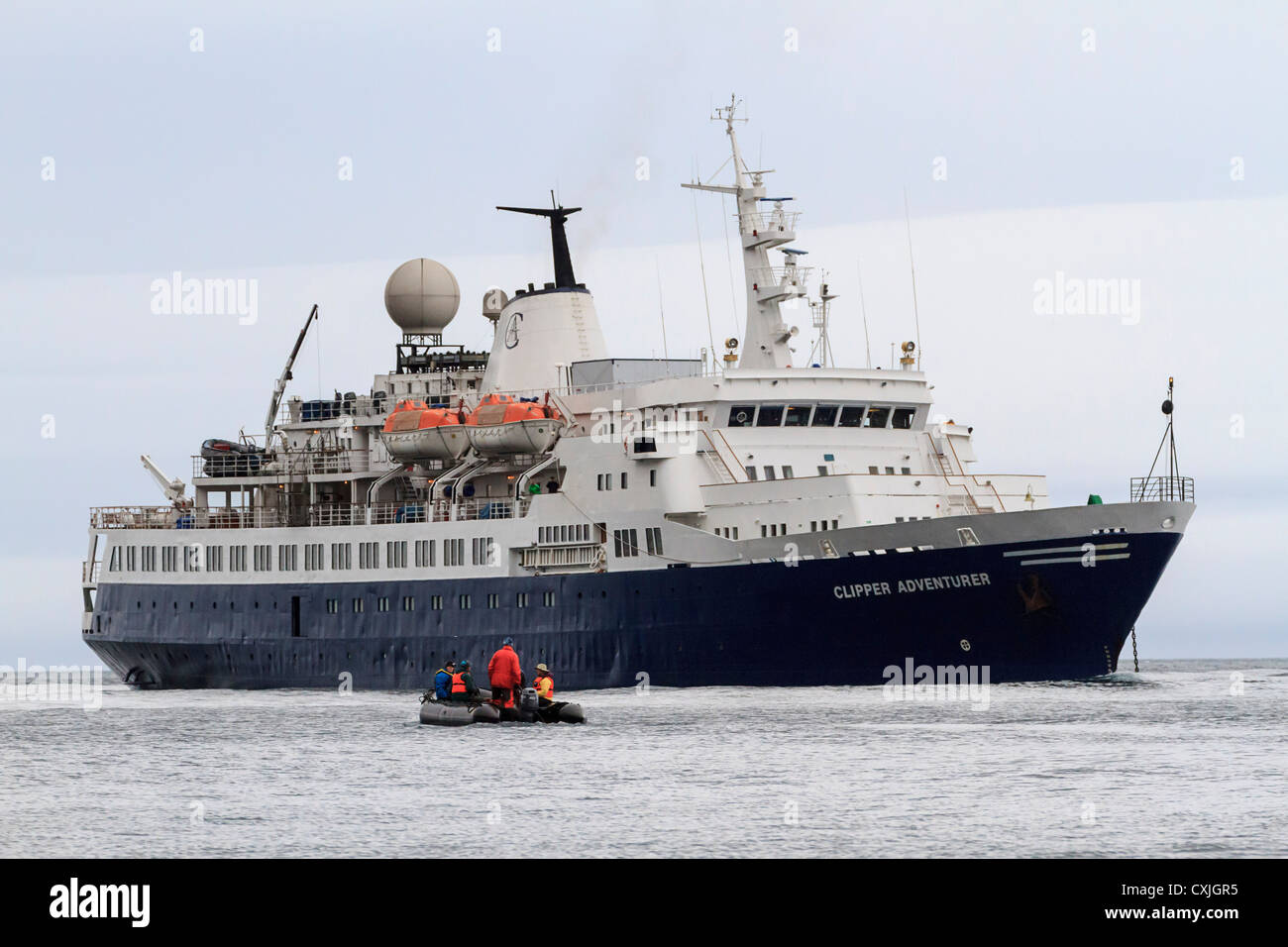 Zodiac boat brings tourists ashore from Clipper Adventurer, an