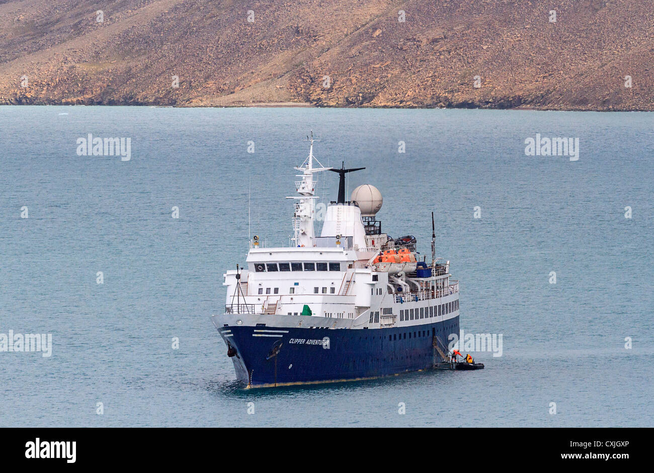 Zodiac boat getting ready to bring tourists ashore from Clipper Adventurer, an expeditionary cruise ship in the Canadian arctic Stock Photo