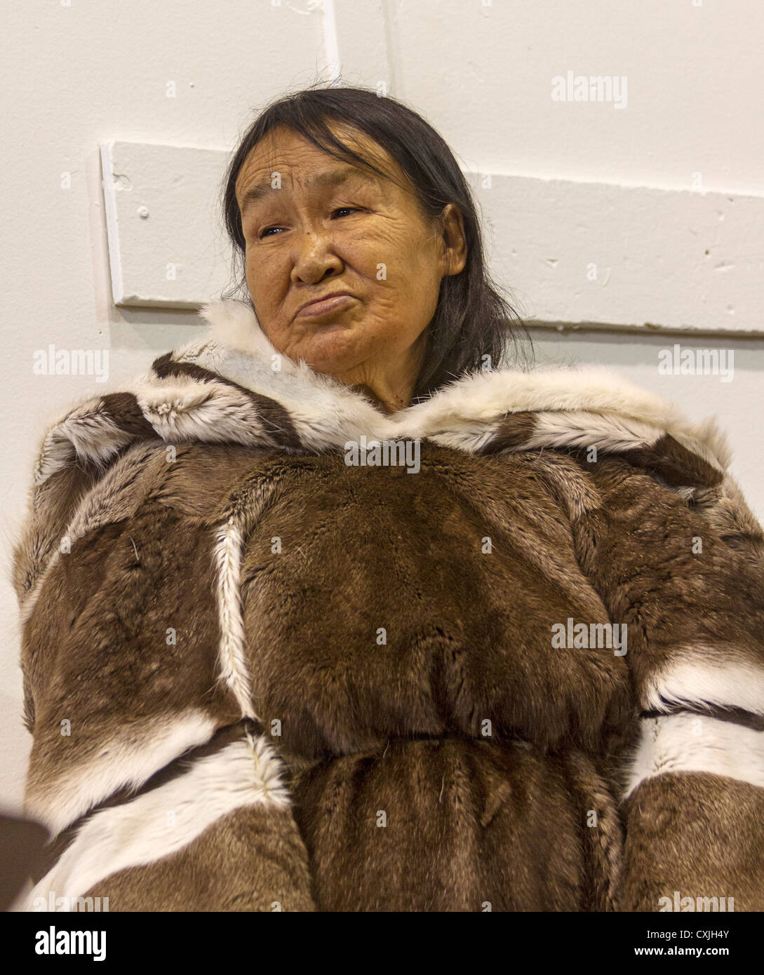 Elderly Inuit woman in traditional skin clothing. Grise Fjord, Nunavut ...