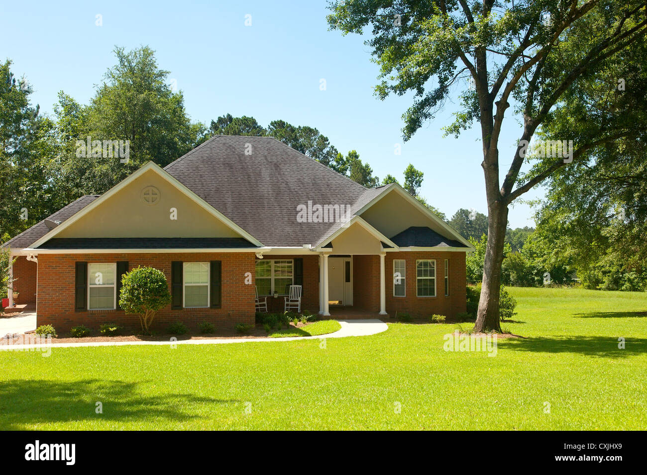 Colonial Brick house on nice landscaped property in Florida Stock Photo