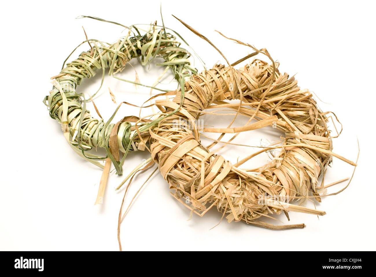 Wreaths made of straw isolated on white Stock Photo