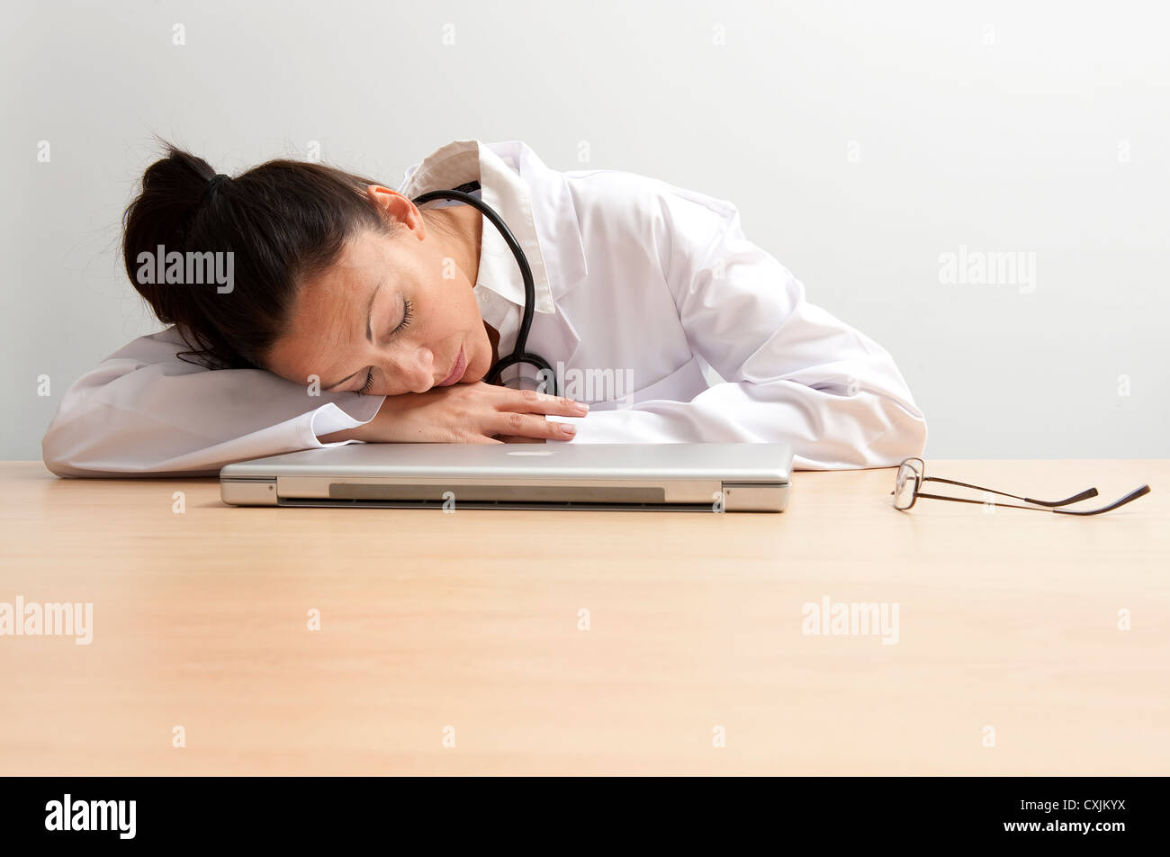 Female Doctor Asleep At Office Desk Stock Photo 50812606 Alamy