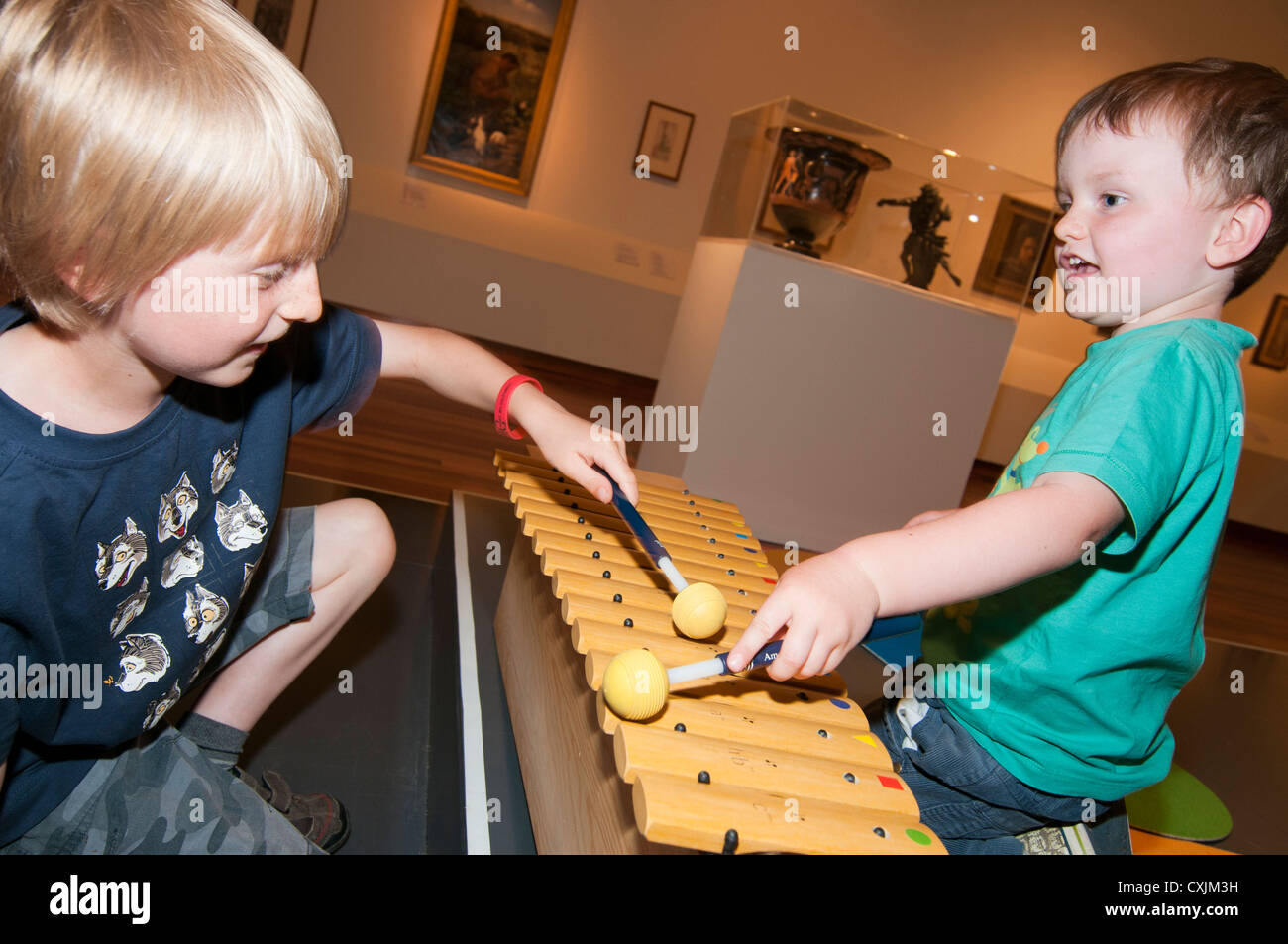 Two boys playing the glockenspiel Stock Photo Alamy