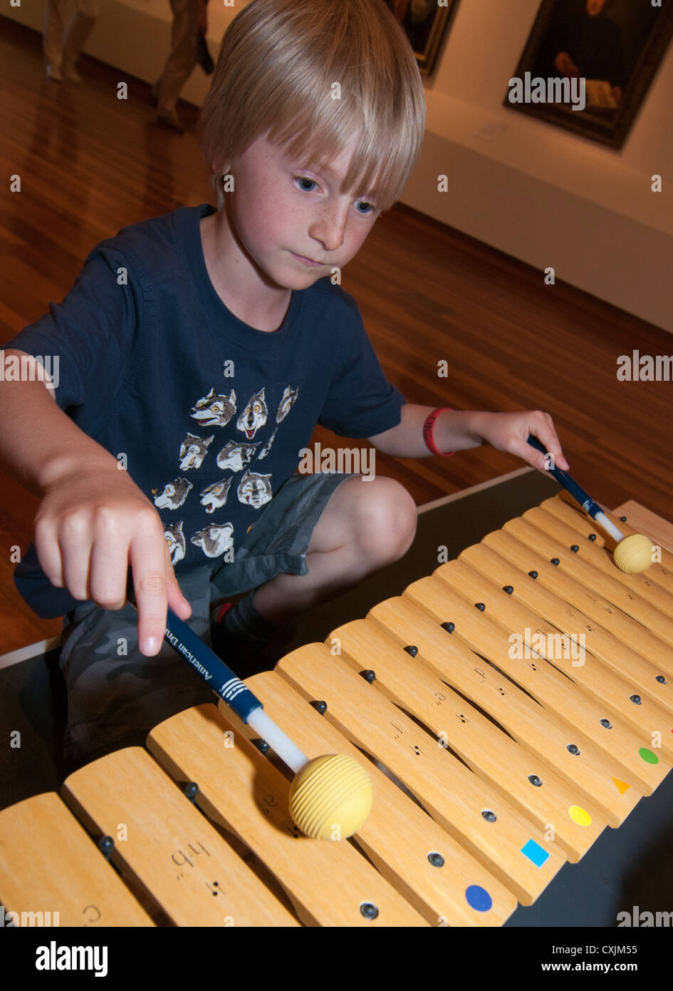 Boy playing the glockenspiel Stock Photo Alamy