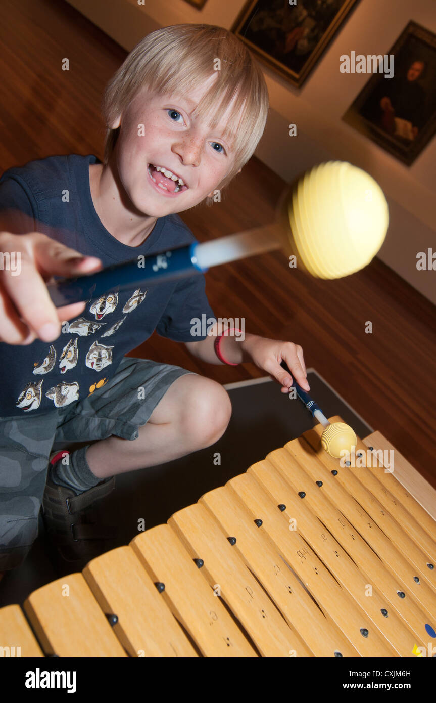 Boy playing the glockenspiel Stock Photo Alamy