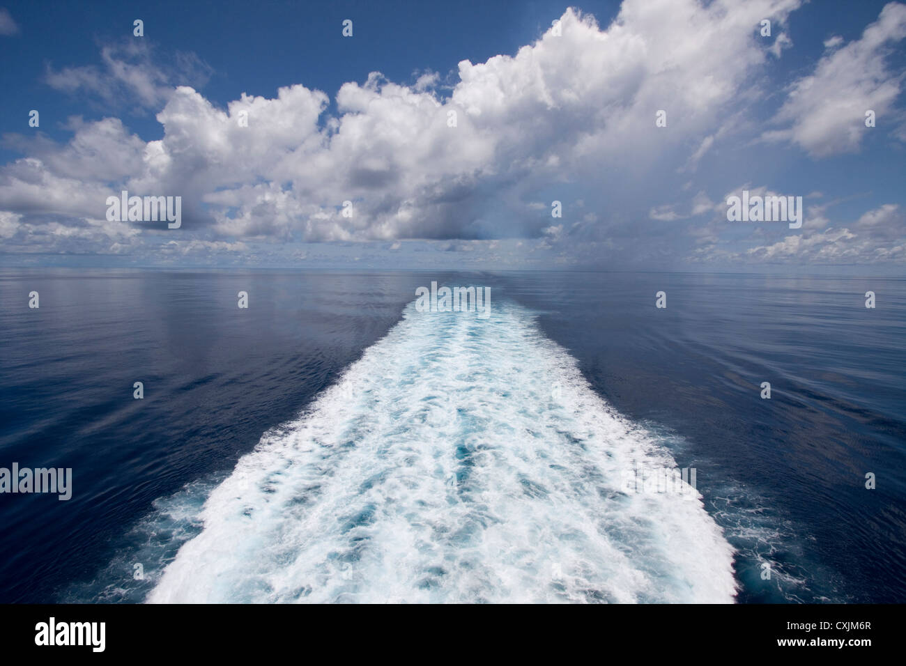 A perfect day sailing calm seas through the Indian Ocean off the coast of Indonesia. Stock Photo
