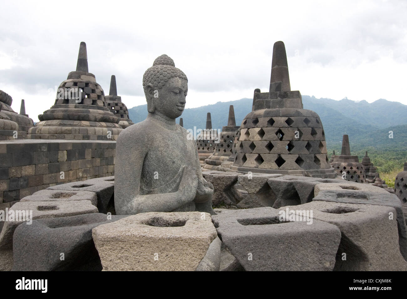 Buddha statue missing its perforated stupa cover, Borobudur, Java, Indonesia. Stock Photo