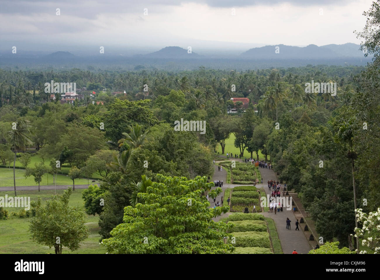 View from the top of Borobudur of lust green forest & extinct volcanoes, Java, Indonesia. Stock Photo