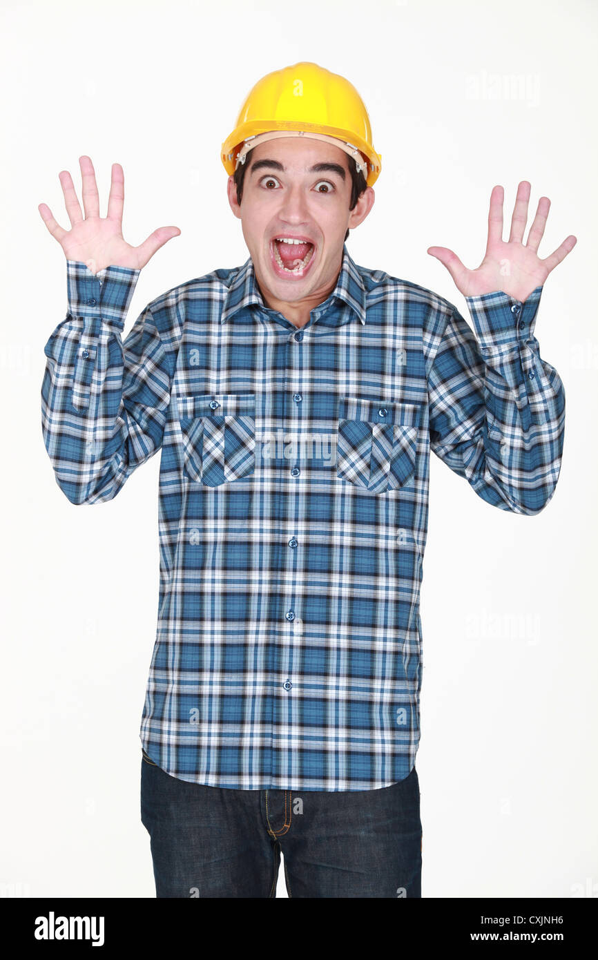 Amazed construction worker Stock Photo - Alamy