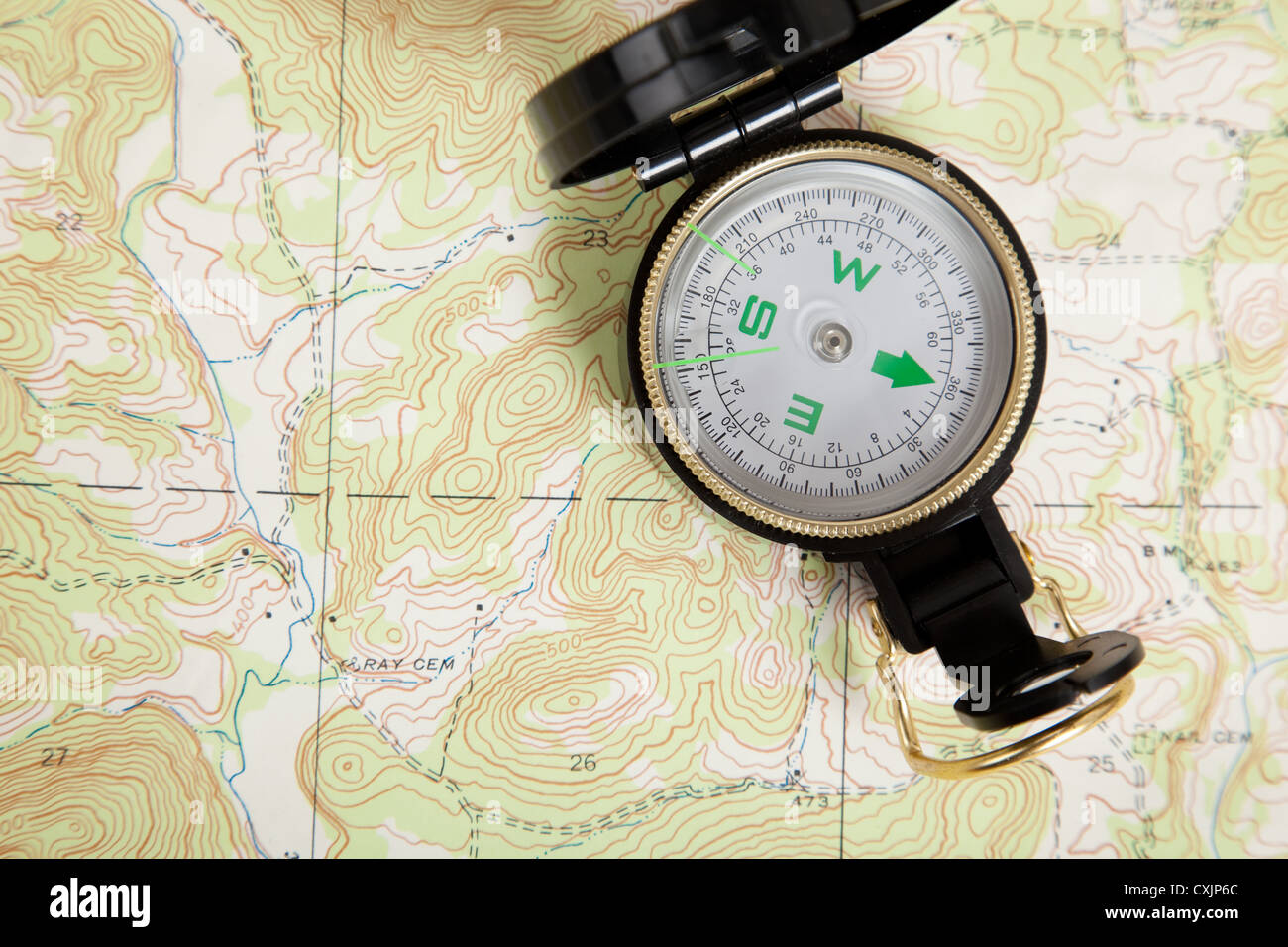 Topographical map and compass Stock Photo