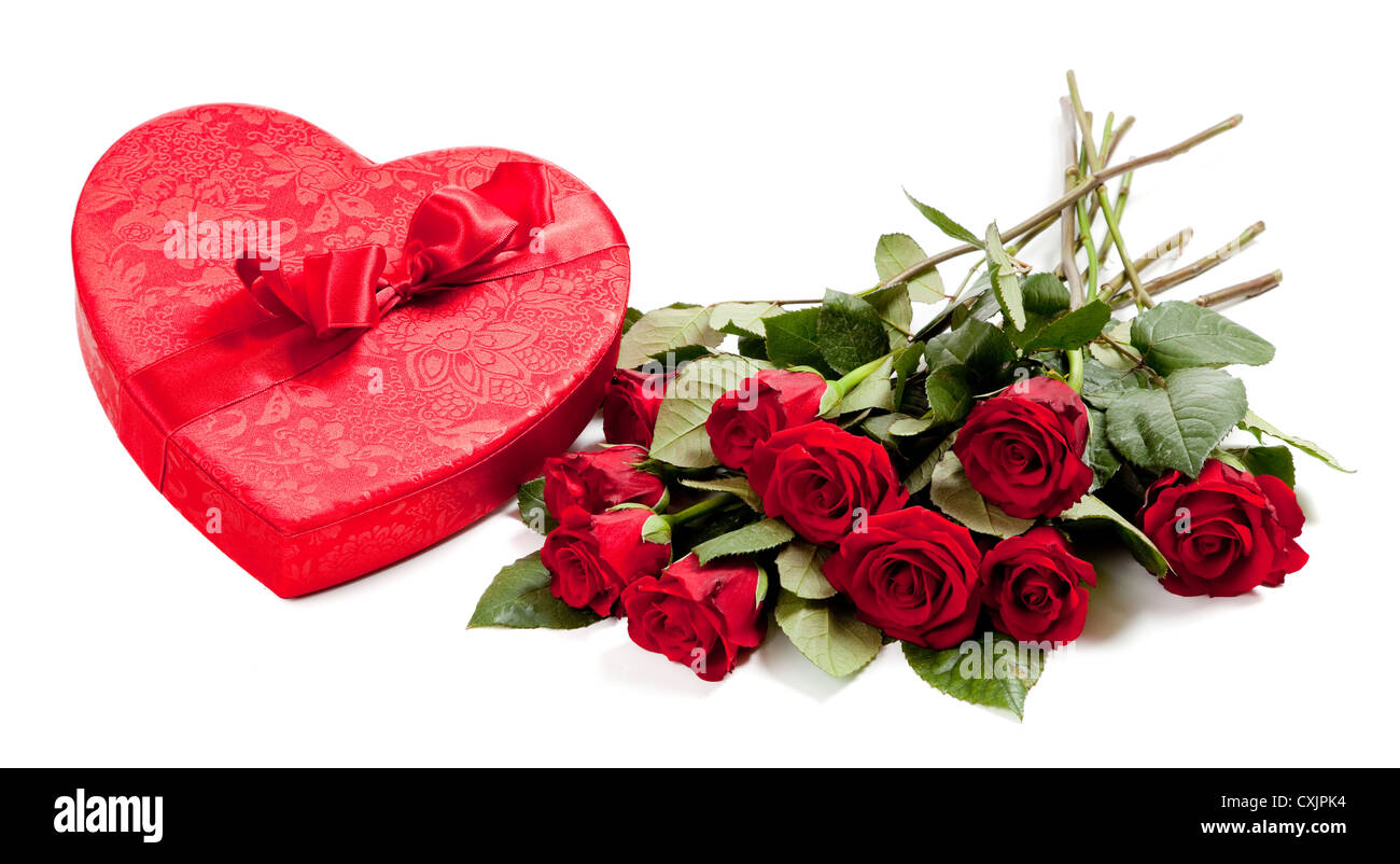 Red heart and red roses on a white background Stock Photo - Alamy