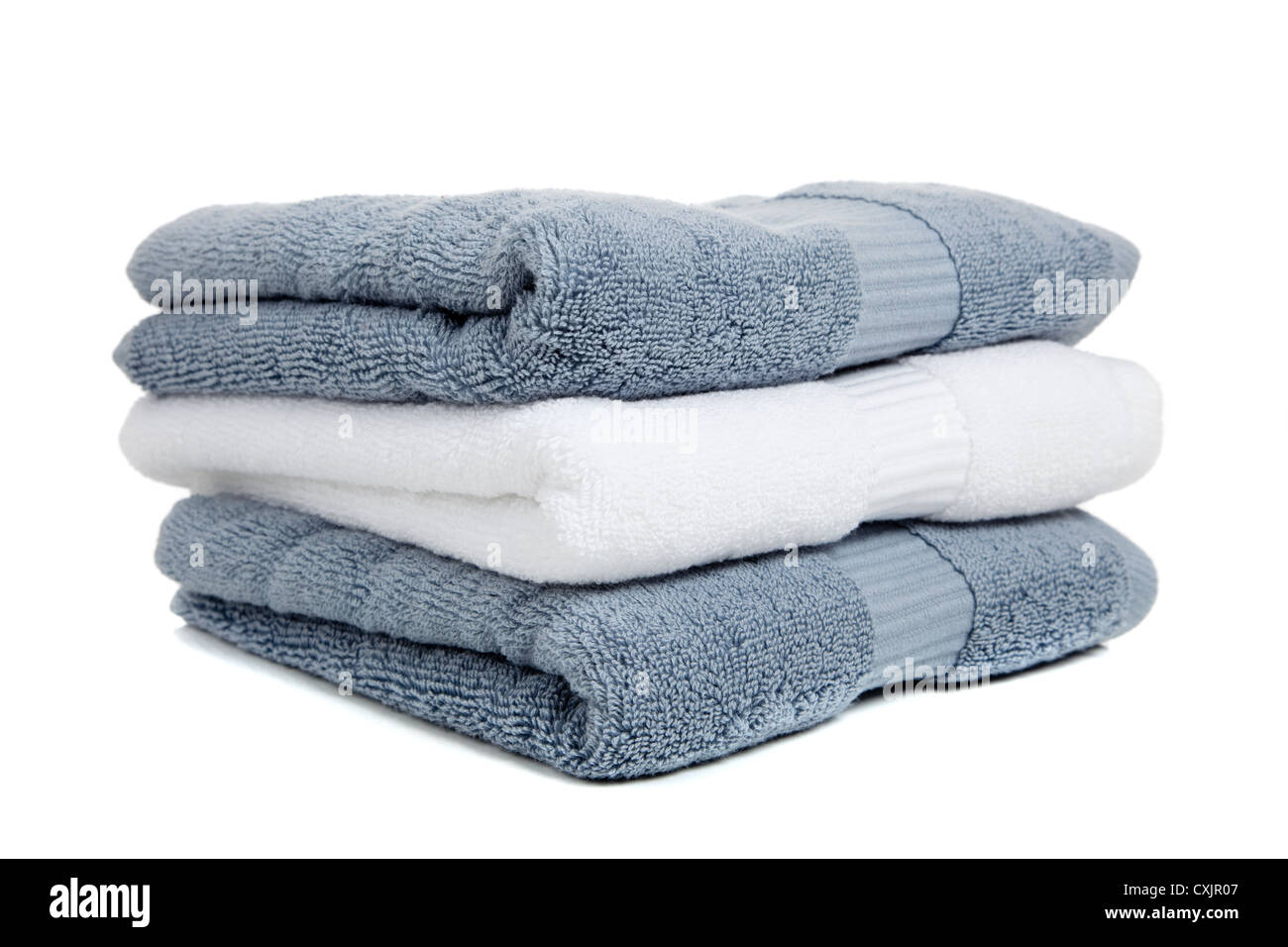 Stack of gray and white towels on a white background Stock Photo