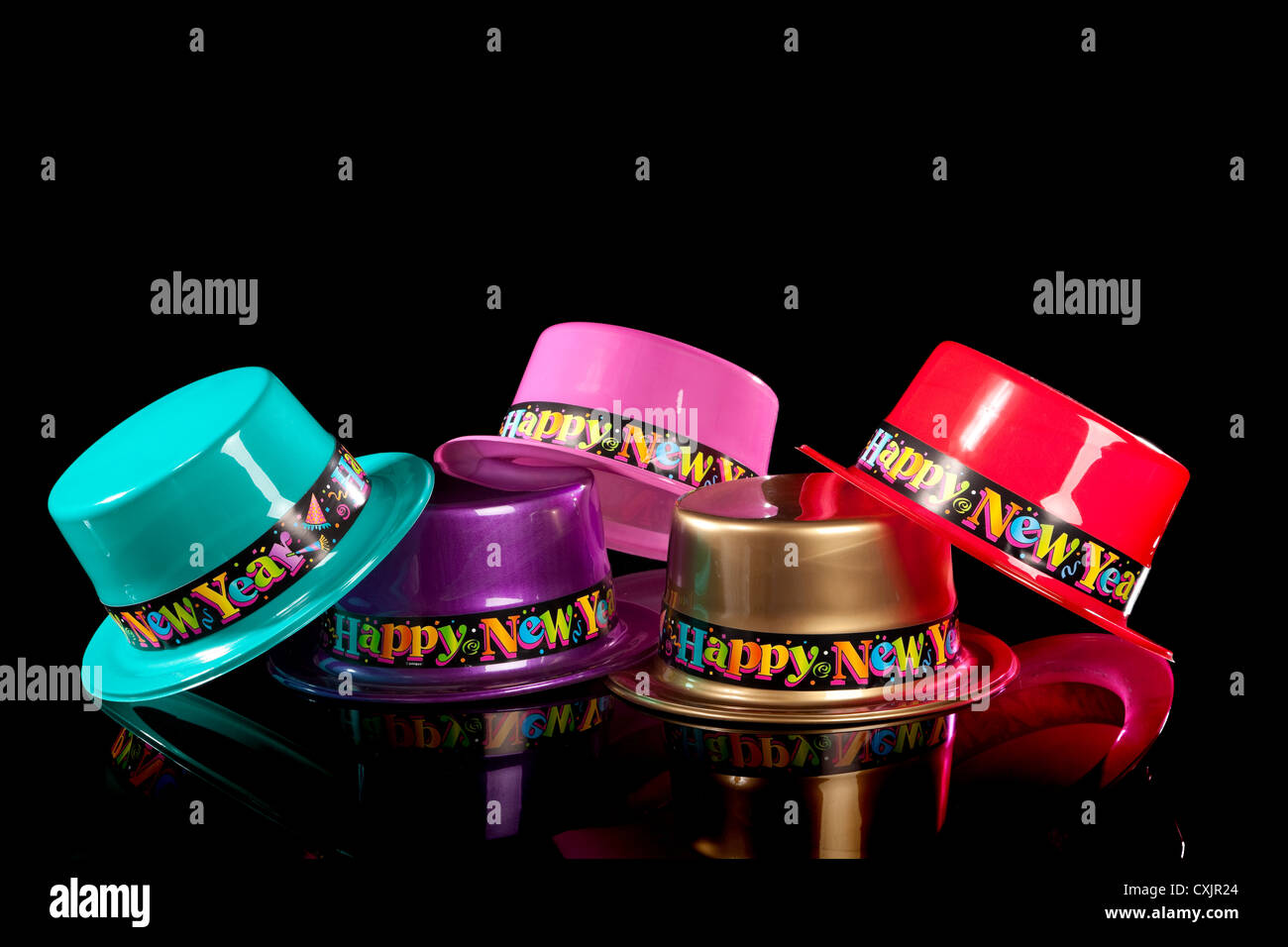 New Year’s Eve party hats on a black background Stock Photo - Alamy
