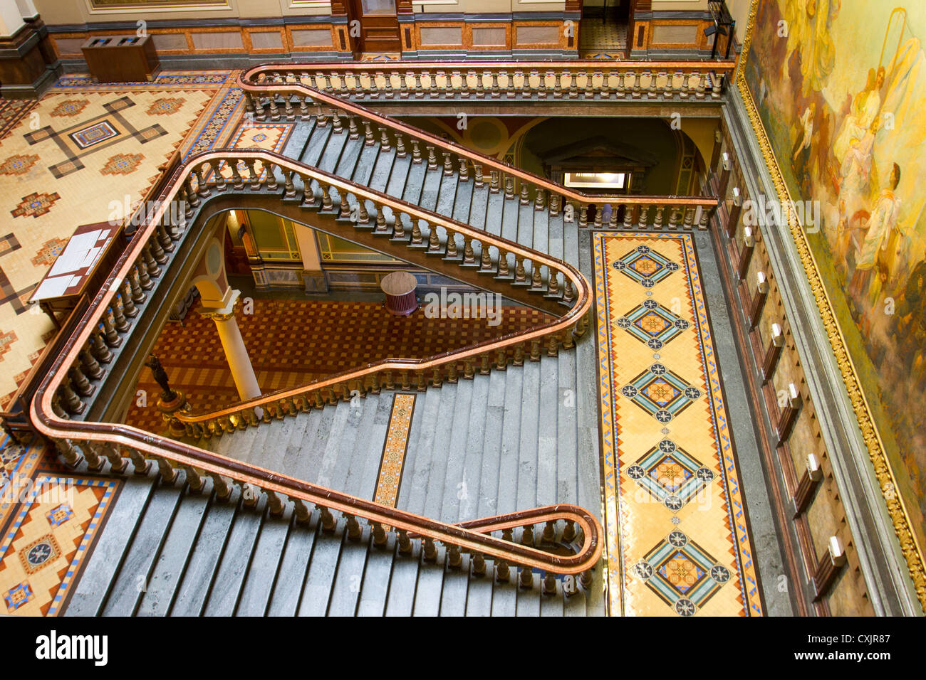 Beautiful staircase and tile work inside the Iowa state capitol building or statehouse in Des Moines Stock Photo