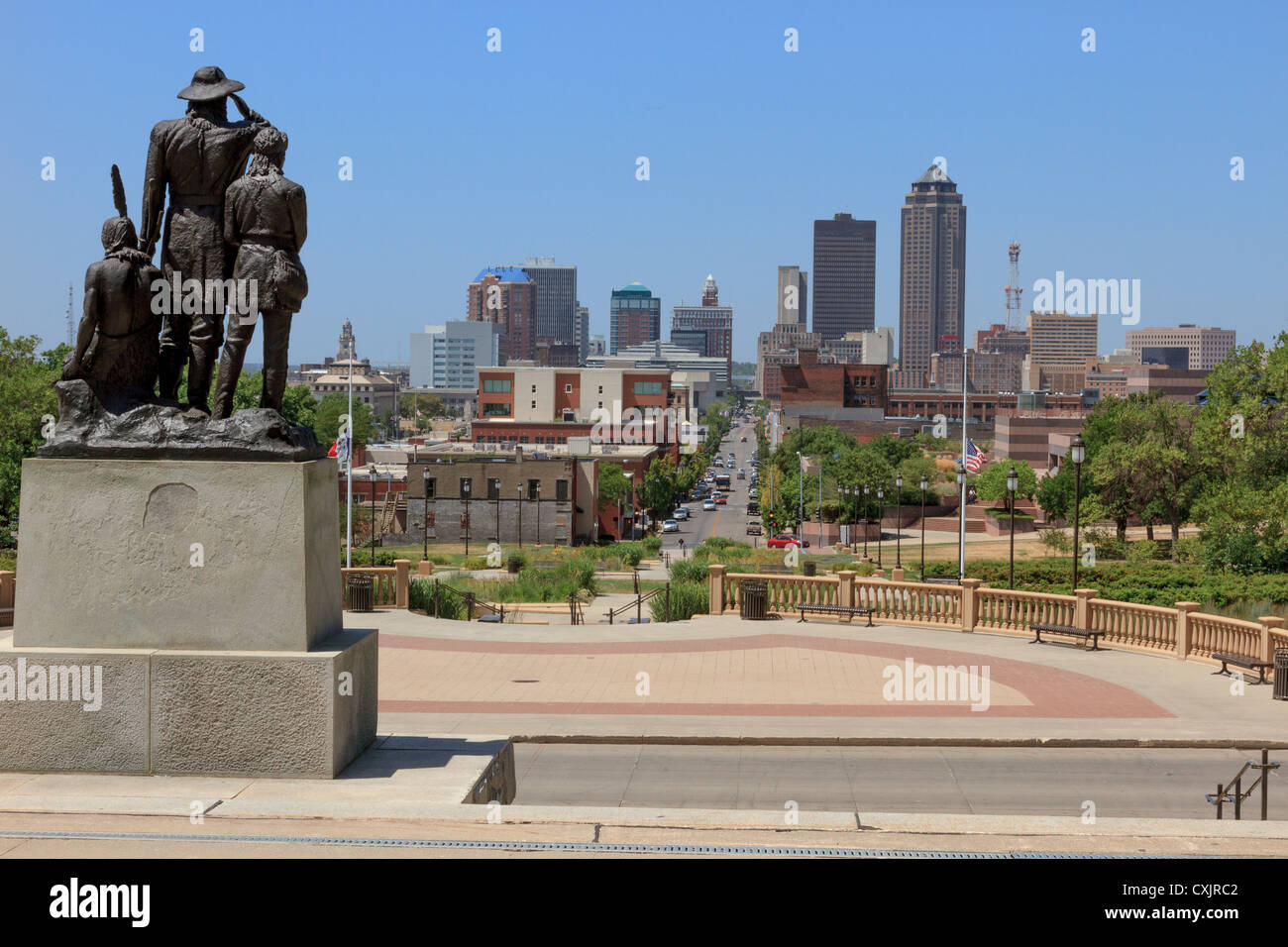 Pioneers of the Territory statue overlooking downtown Des Moines skyline in Iowa Stock Photo