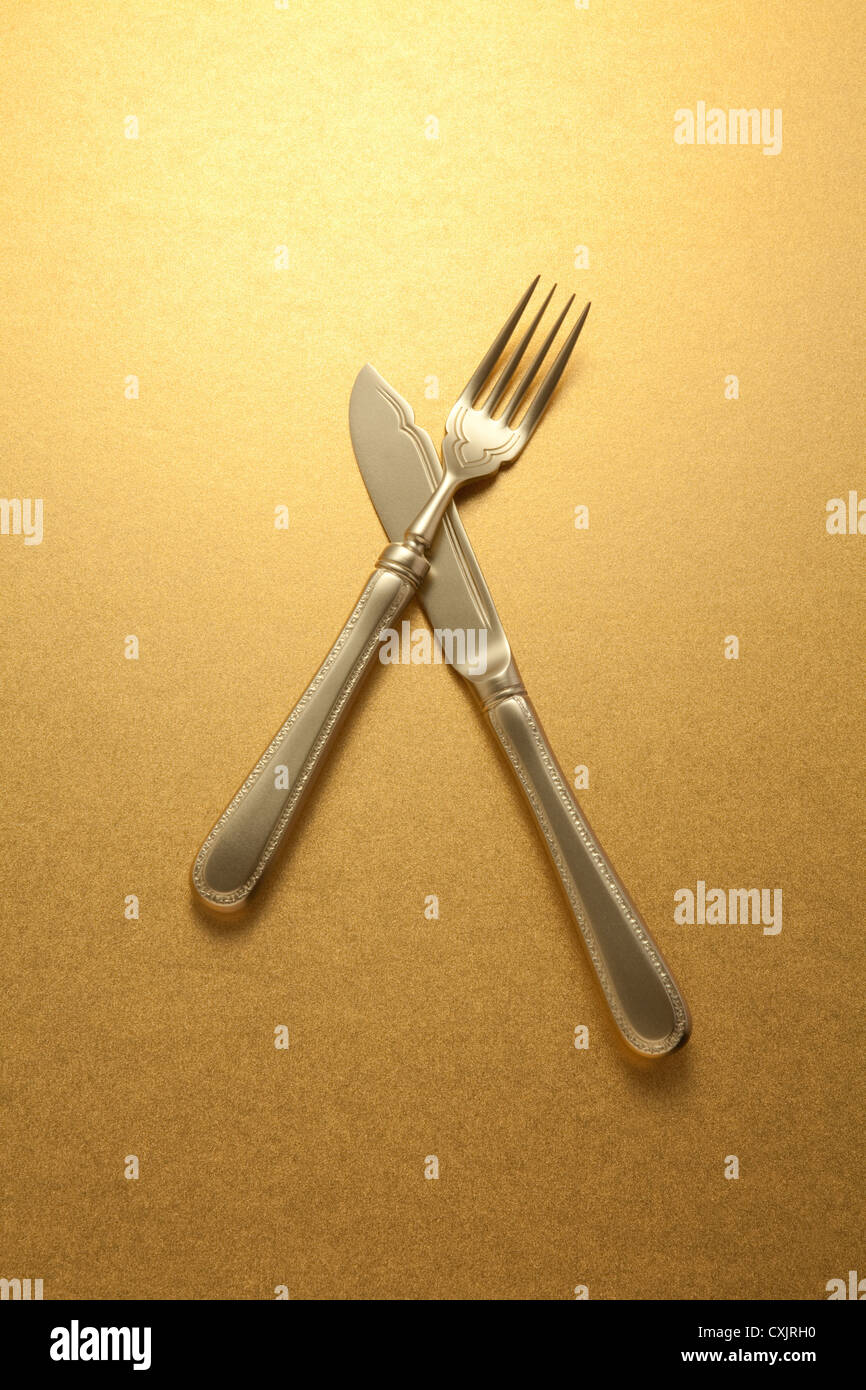 Gold knife and fork Stock Photo Alamy