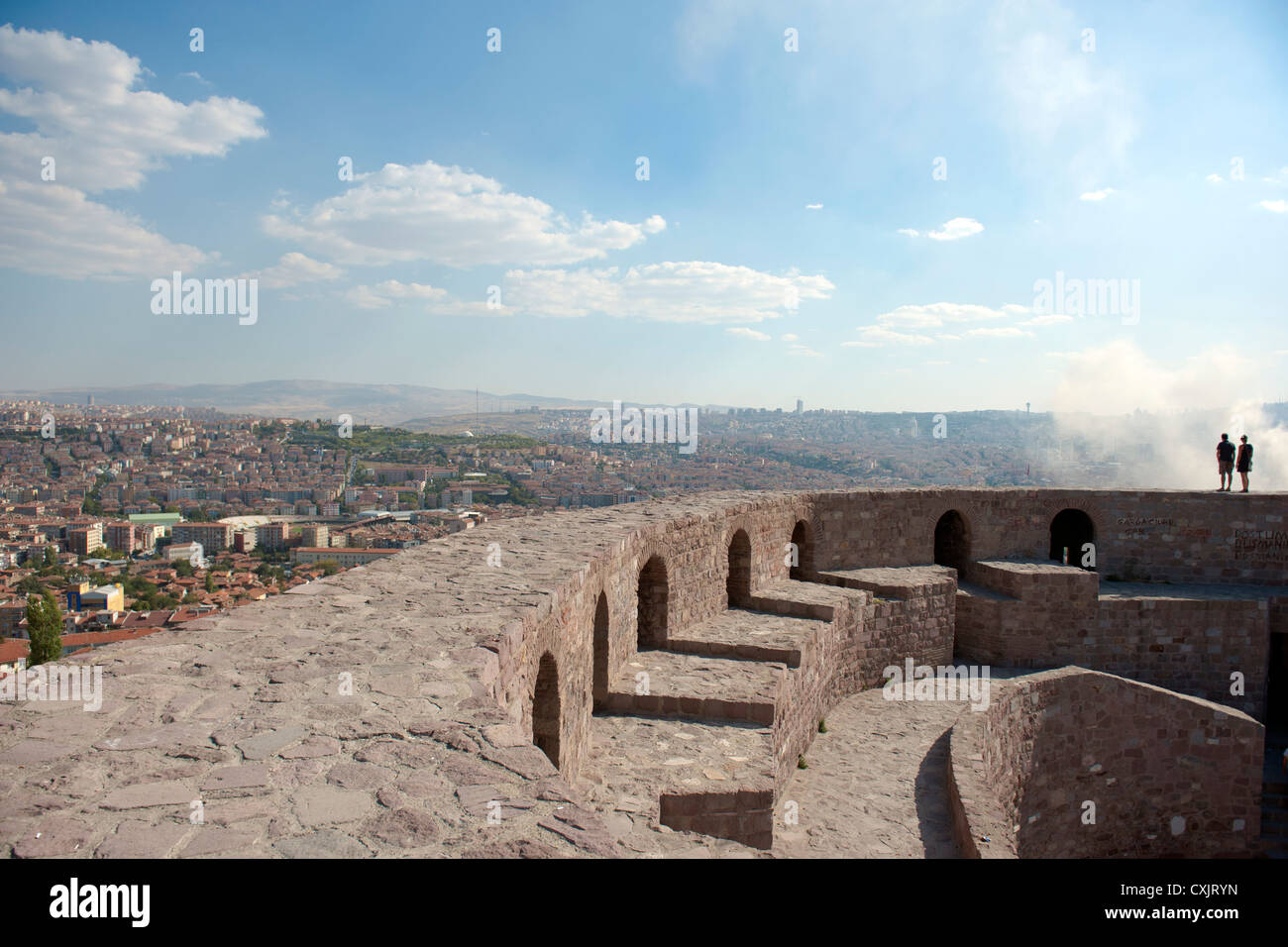 Two men on the upper remparts of the citadel crowning the city skyline of Ankara, capital of Turkey Stock Photo