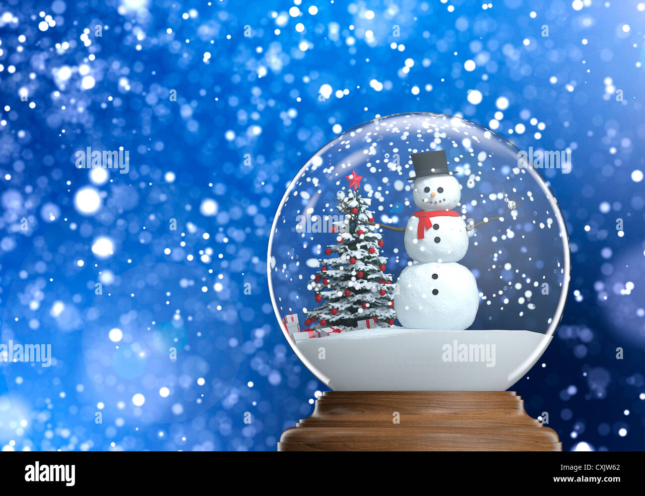 snowglobe with snowman and christmas tree inside on a blue snowy defocused  background copy space and clipping path Stock Photo - Alamy