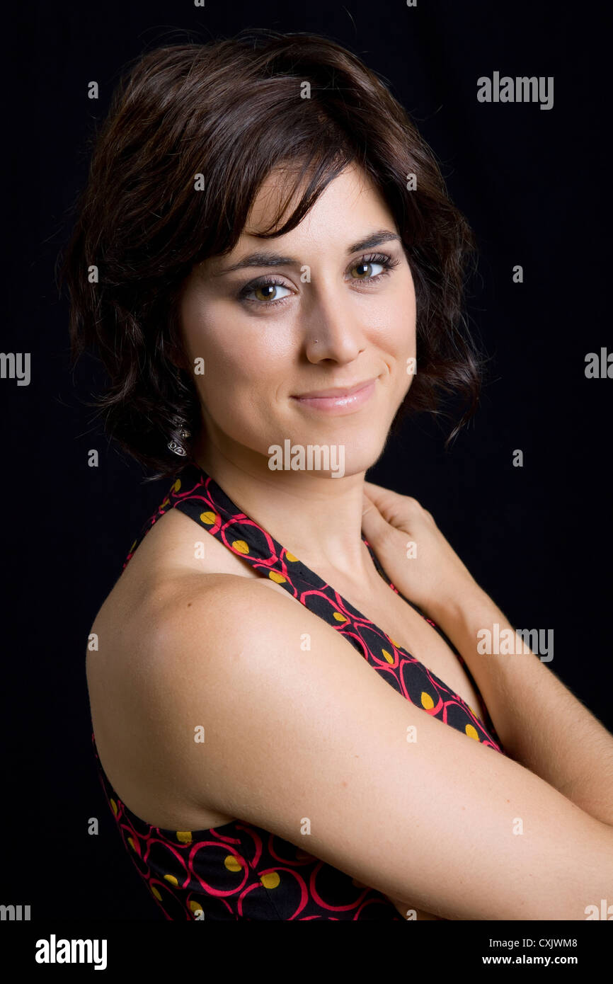 young beautiful brunette portrait against black background Stock Photo ...