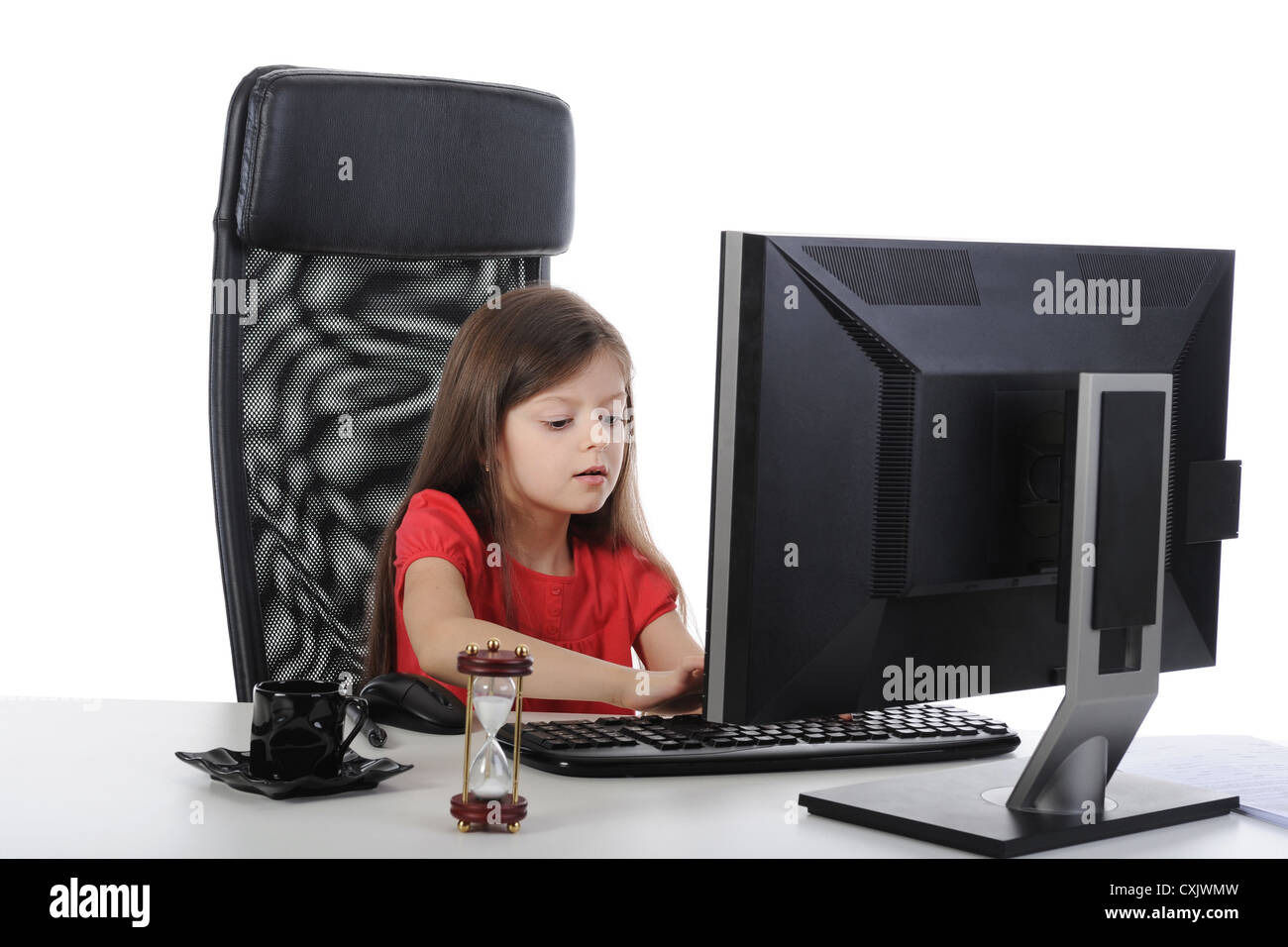 Little girl in the office computer. Stock Photo