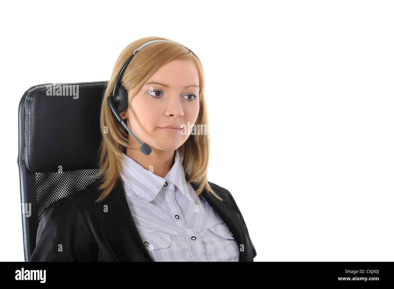 Young office worker with headset. Stock Photo