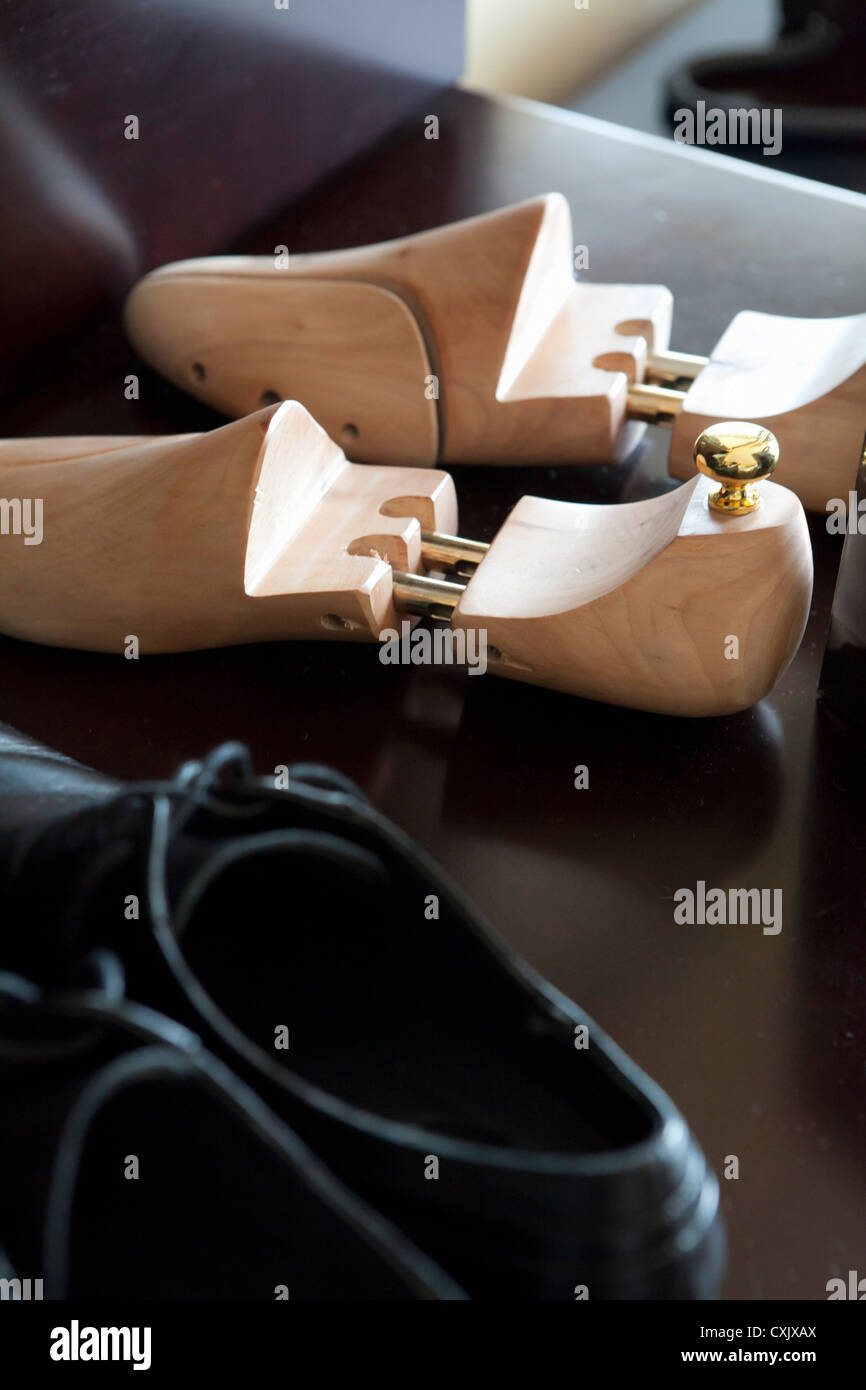 Close-up of Wooden Shoe Tree and Men's Dress Shoes Stock Photo