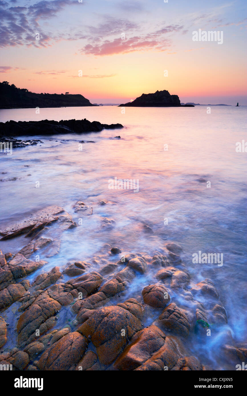 Rocky Coastline at Sunset, Bay of Morlaix, Finistere, Brittany, France Stock Photo