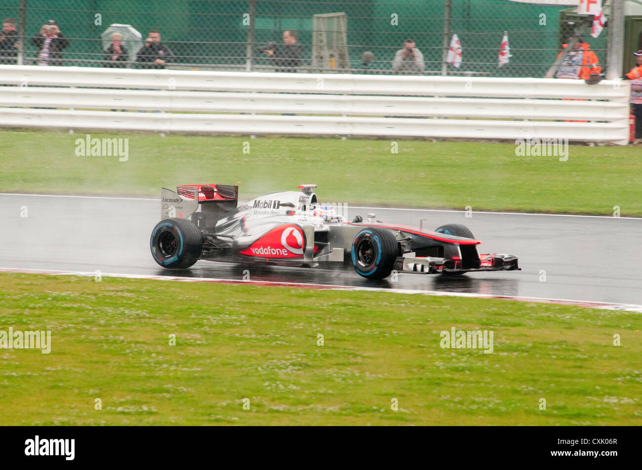 Jenson Button in his Lotus F1 Car in the Wet Stock Photo