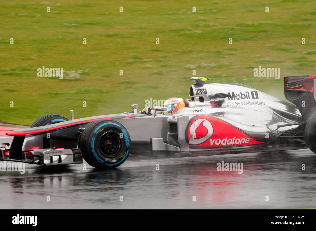 Lewis Hamilton in his McLaren F1 Car in the Wet Stock Photo