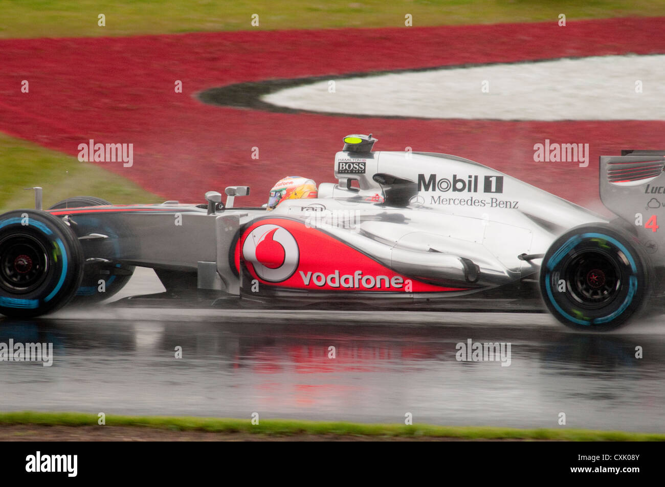 Lewis Hamilton in his McLaren F1 Car in the Wet Stock Photo