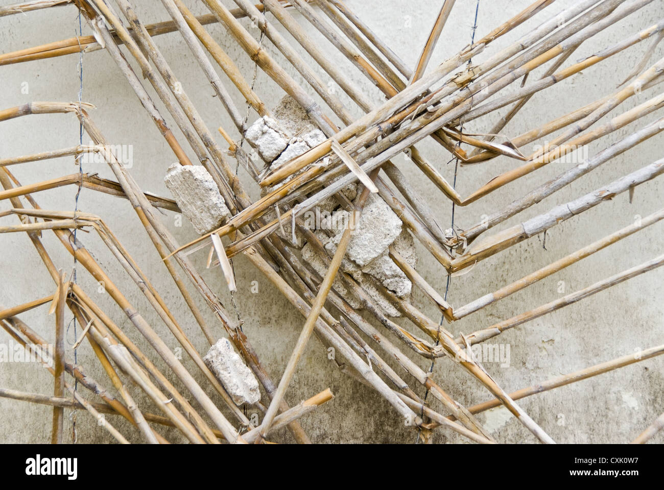 Straw mat with remnants of plaster Stock Photo
