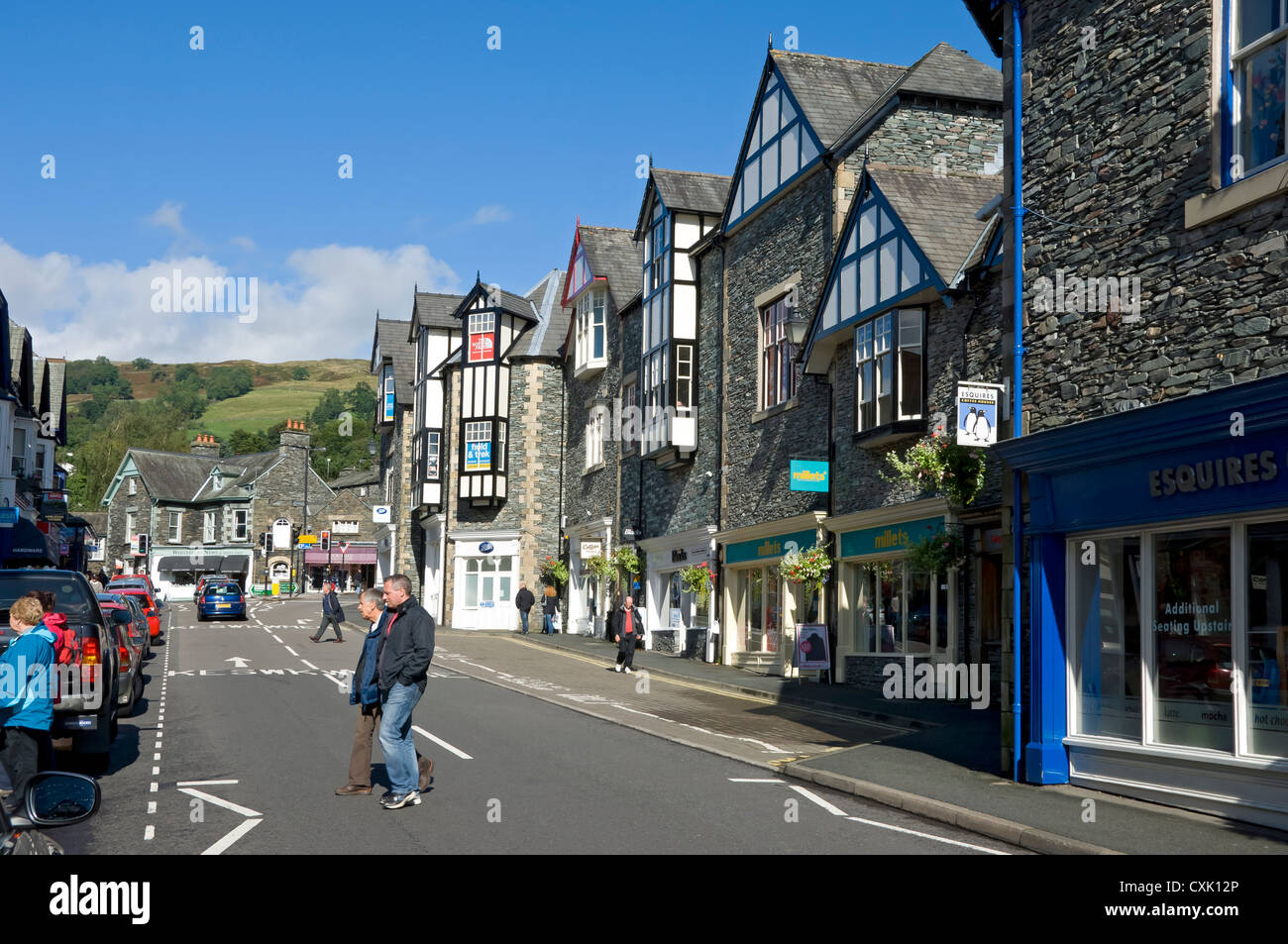 Shops stores in Ambleside town centre in summer Cumbria England UK United Kingdom GB Great Britain Stock Photo