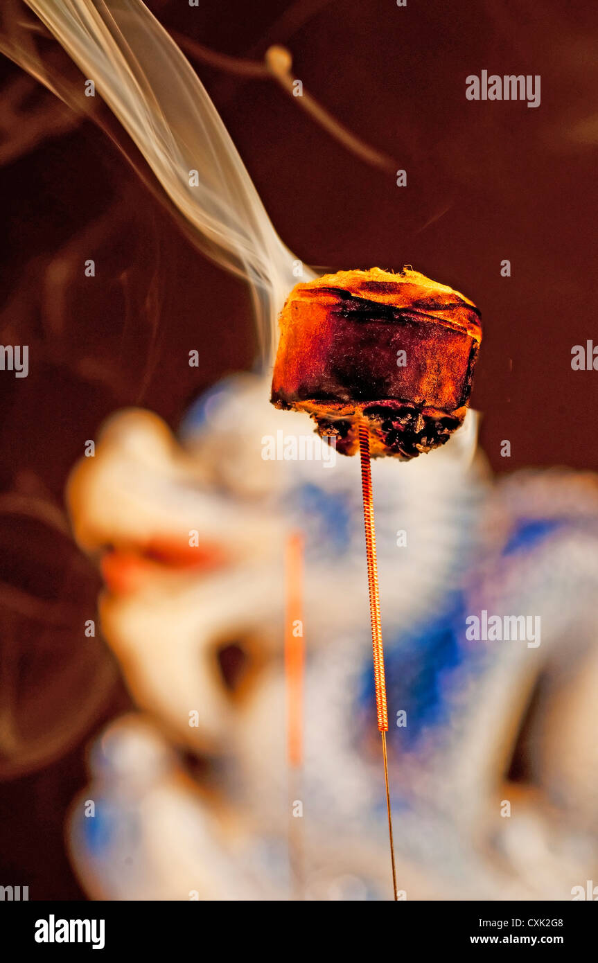 acupuncture needle with moxibustion, a Chinese natural warming therapy