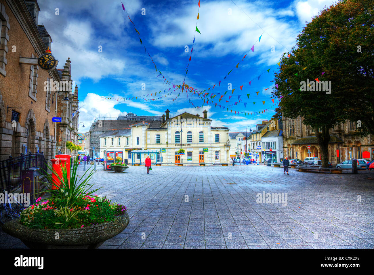 Digitally altered with HDR market place in Falmouth, Cornwall with bunting meeting overhead Stock Photo