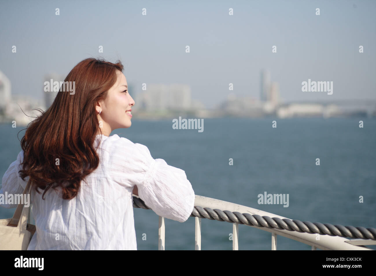 Woman looking at the sea Stock Photo - Alamy