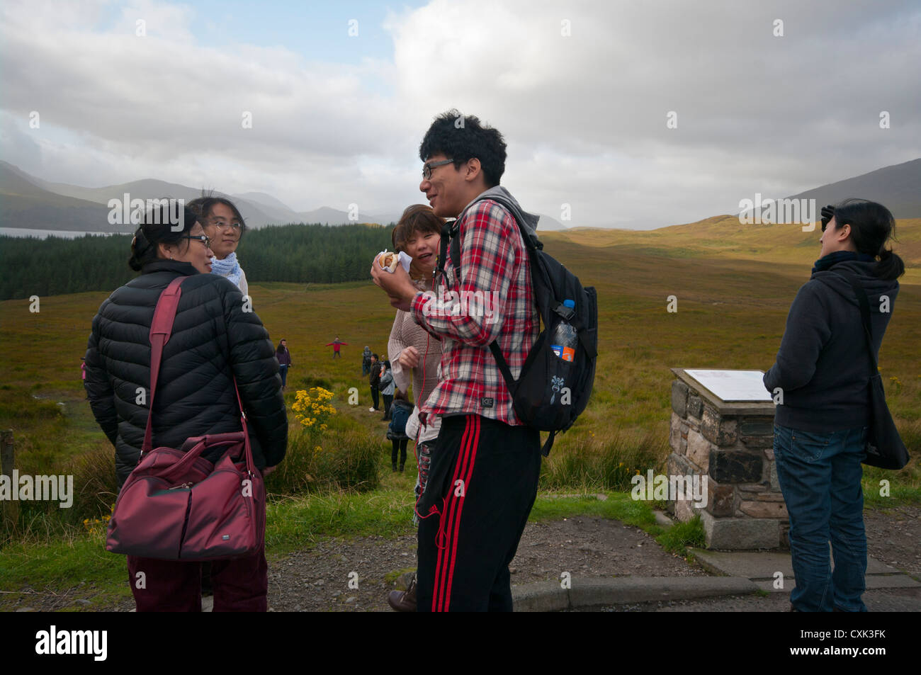 Young japanese Tourists In Glen Coe Scotland Stock Photo
