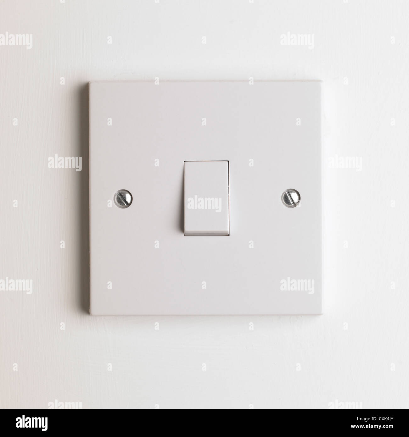 Interior white wall light switch on white background Stock Photo