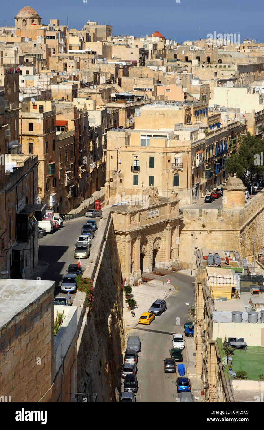 Sandstone buildings overlook Victoria Gate in the city of Valetta, Malta. Stock Photo