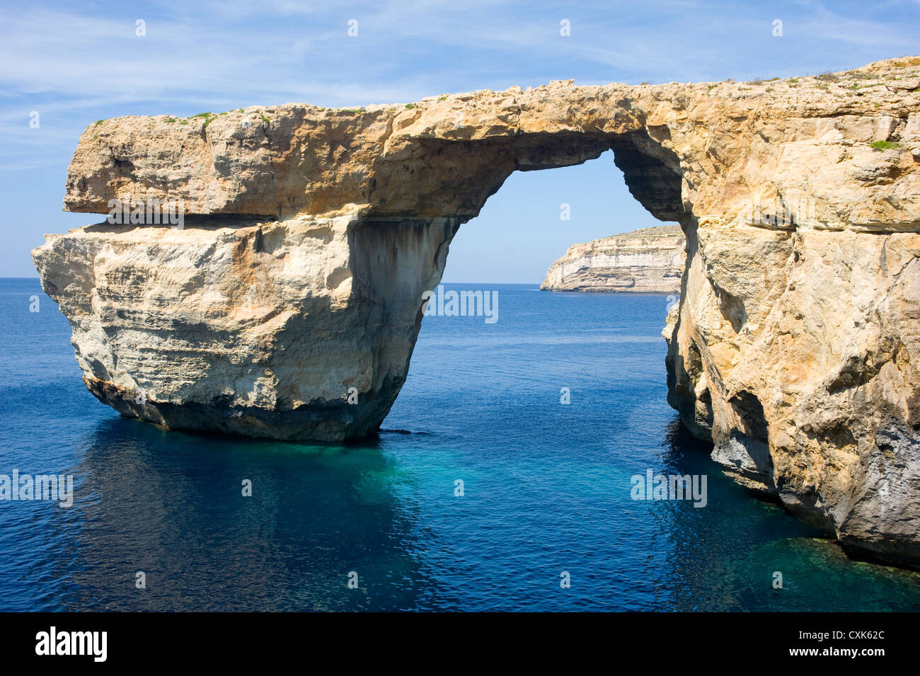 The crystal clear waters around the Azure Window, Gozo Island, Malta. Upright shot. Stock Photo