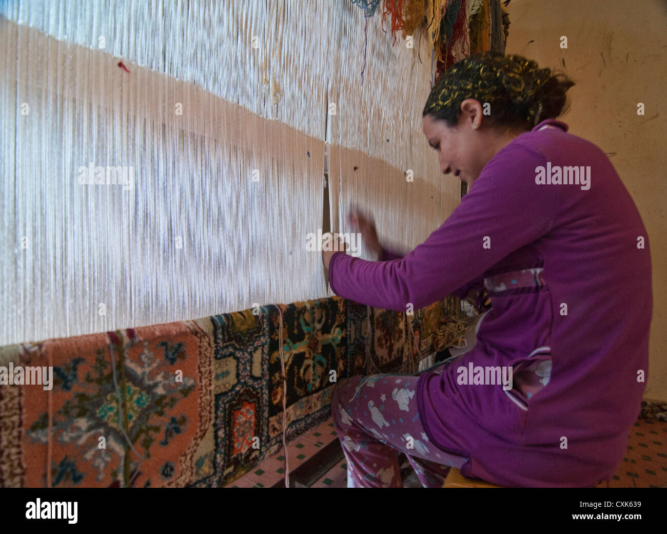 carpet weaver in the ancient medina of Fes, Morocco Stock Photo Alamy