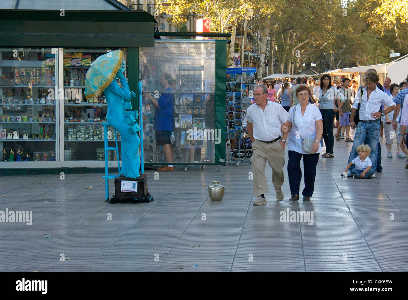 tourist with human statue street performer in las ramblas street in barcelona.spain,europe Stock Photo