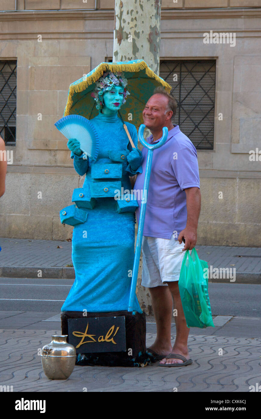 tourist with human statue street performer in las ramblas street in barcelona.spain,europe Stock Photo