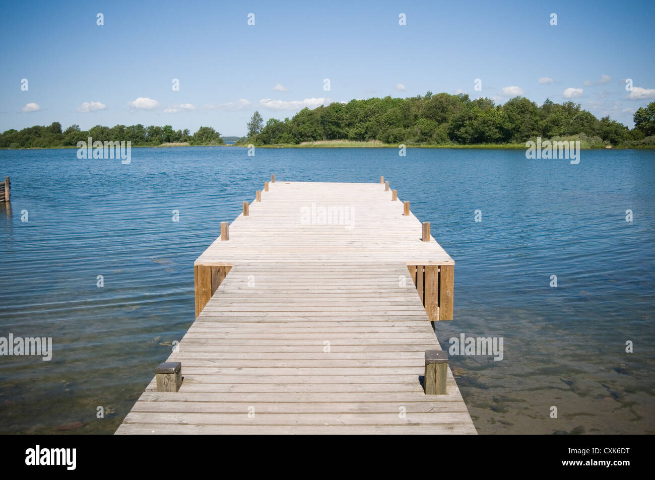lake lakes water blue summer sky skies sweden swedish pontoon boardwalk timber swimming Stock Photo