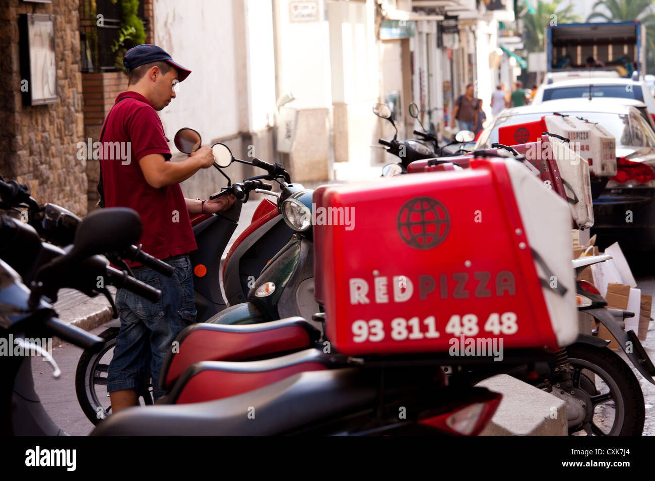 Pizza delivery man on motorcycle hires stock photography and images