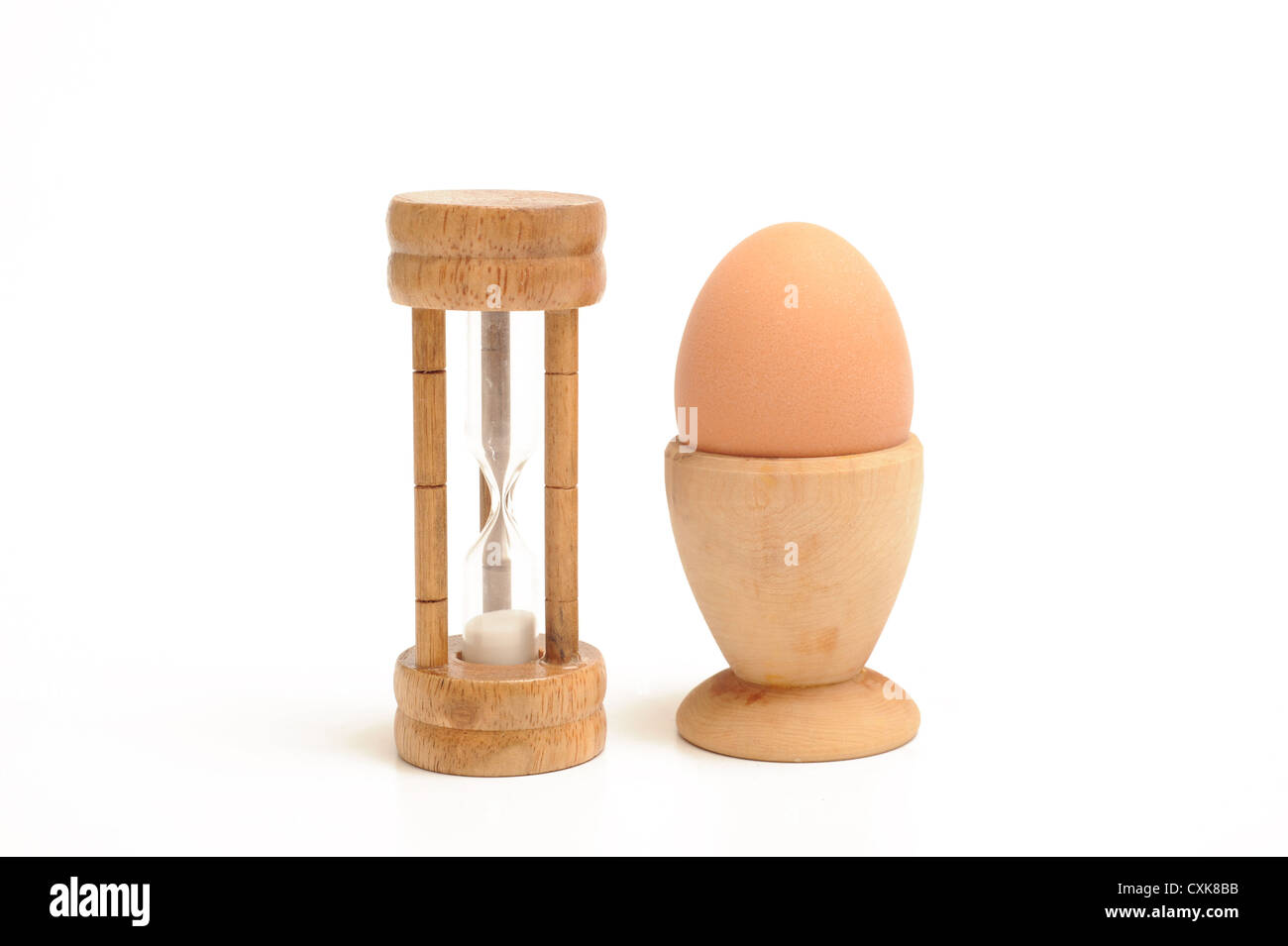 Egg timer and boiled egg Stock Photo