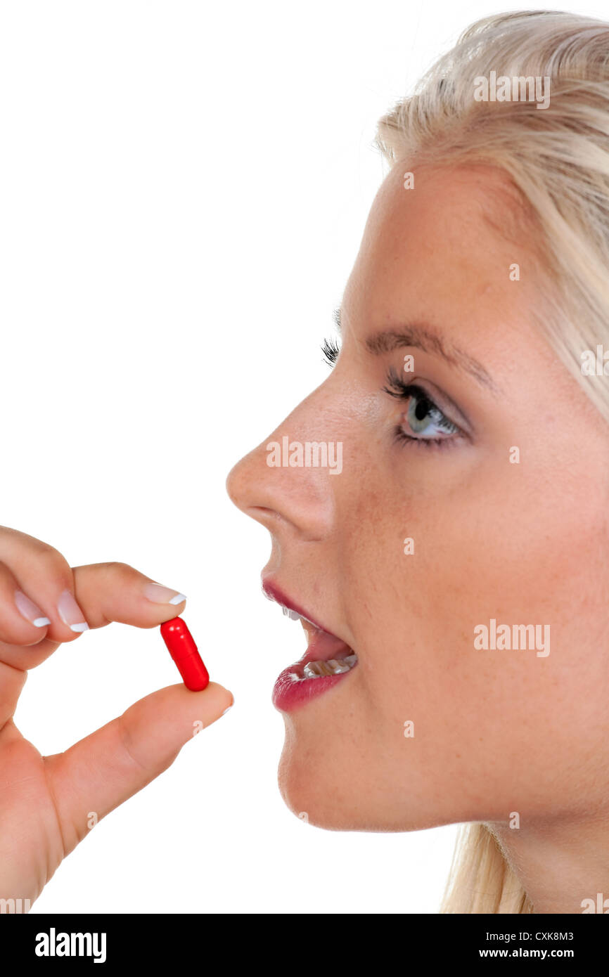 Woman with many pills on a spoon Stock Photo