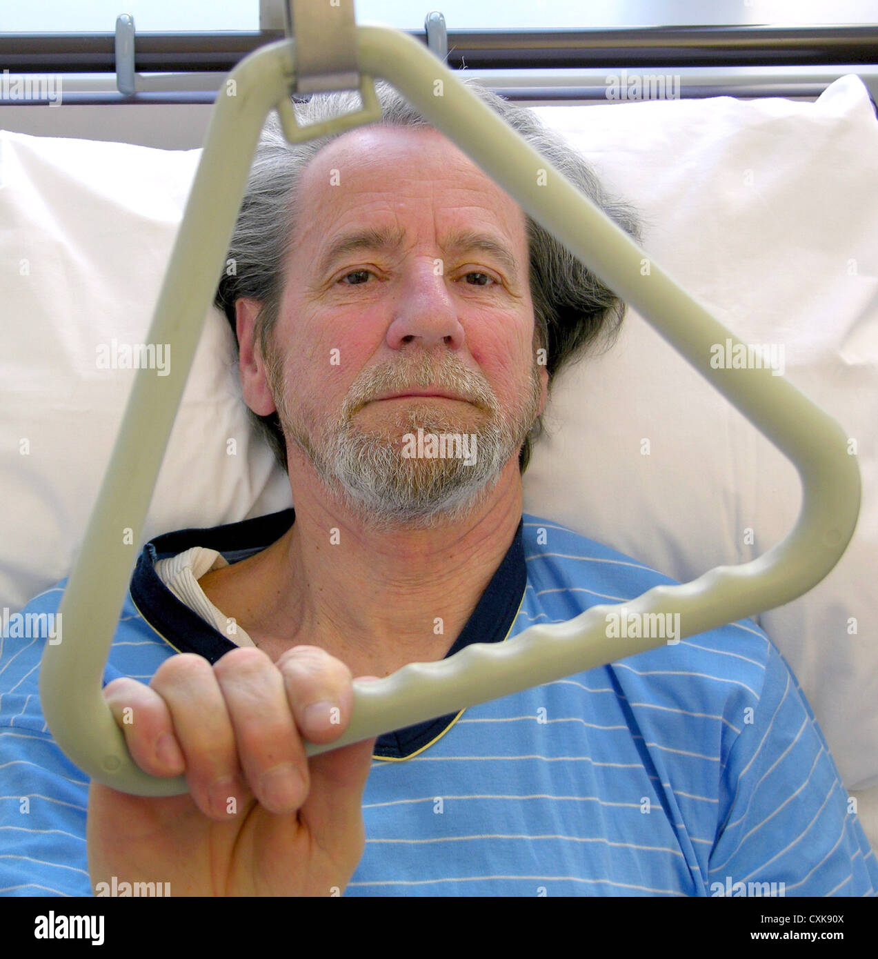 Man in a hospital bed Stock Photo