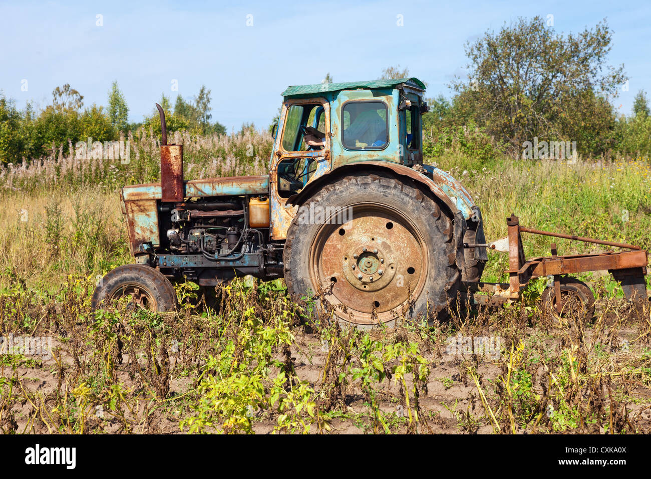 Old tractor in the field Stock Photo - Alamy