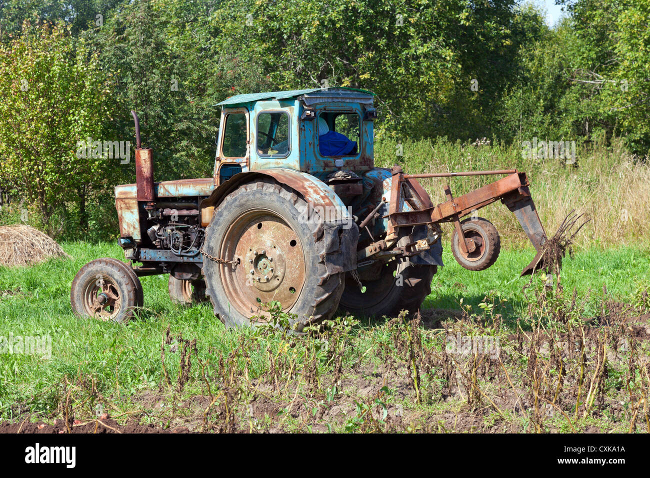 Old tractor in the field Stock Photo - Alamy
